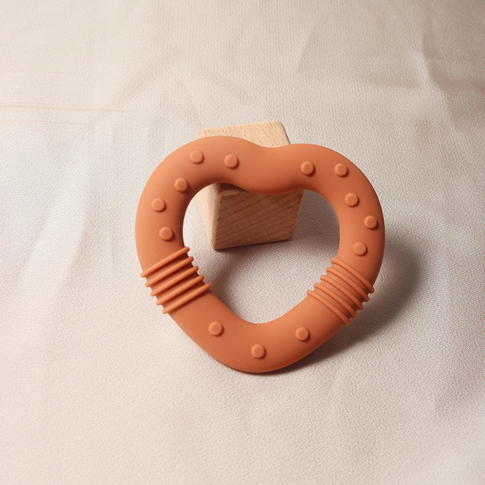 Nuevo 2024 estrella mordedor de silicona Grado alimenticio juguete para la dentición de bebé en forma de corazón.
